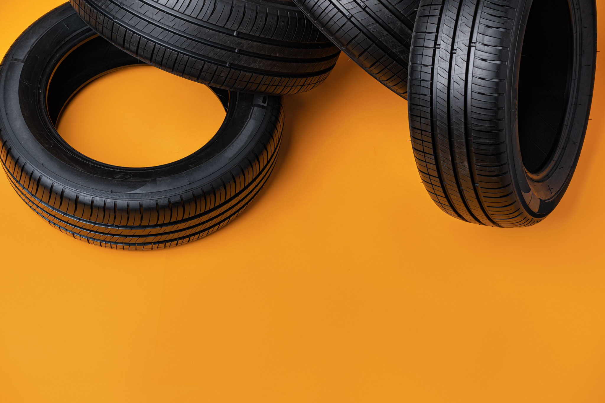 group of tires on a yellow background