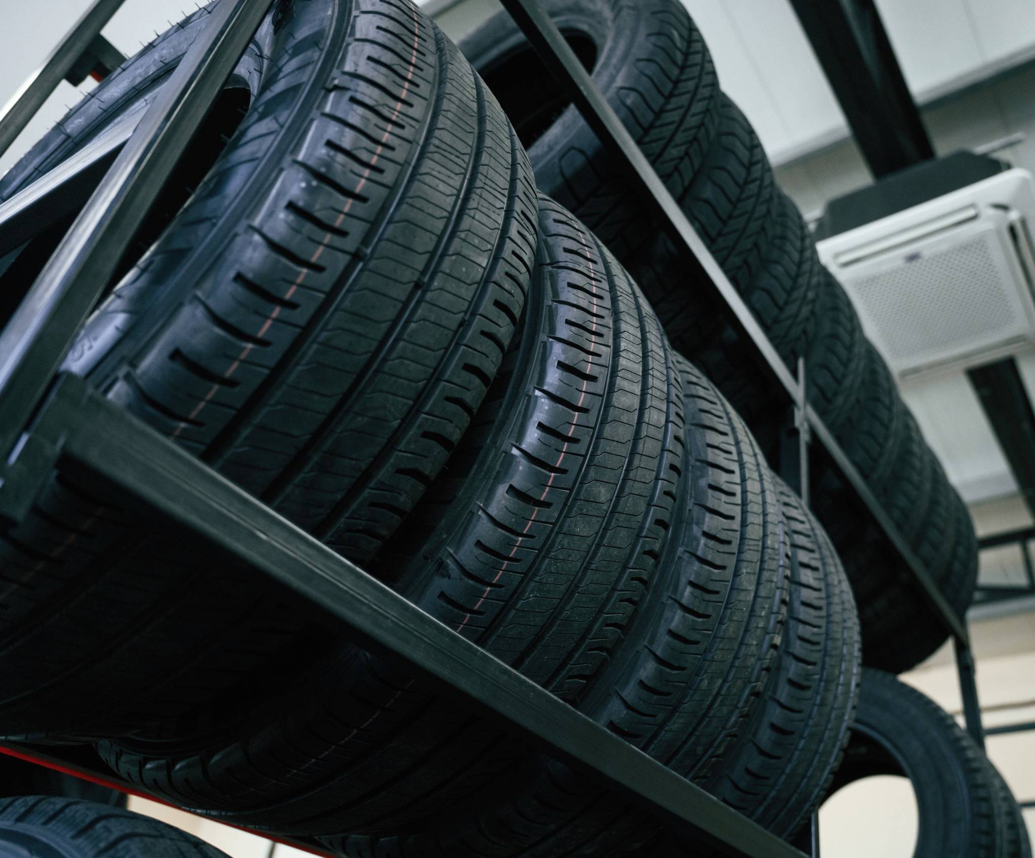 line of tires on warehouse shelf