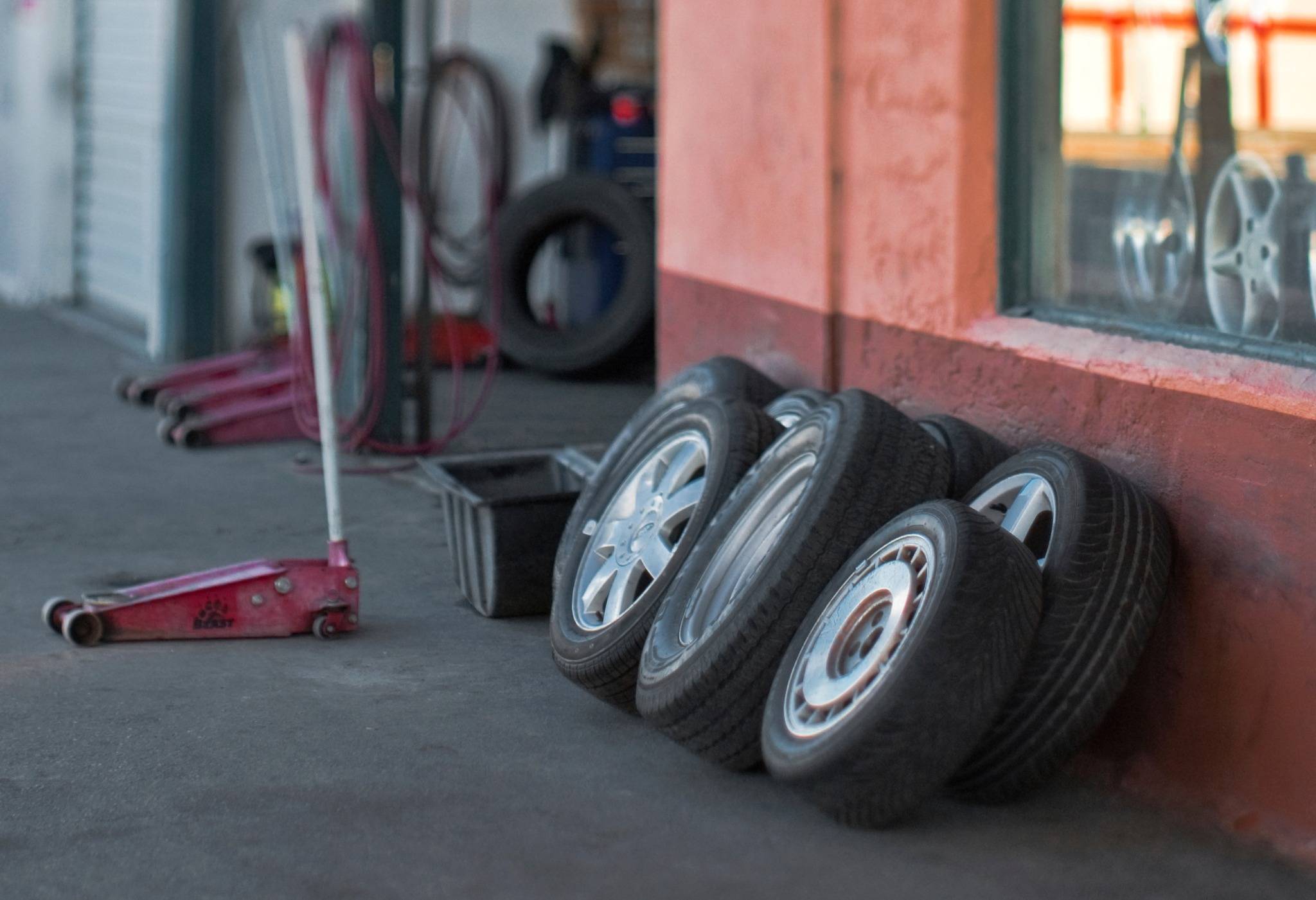 line of tires against wall at shop