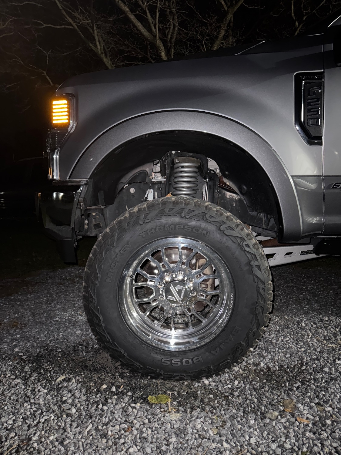 Close-up comparison of a 6-lug half ton hub next to an 8-lug heavy duty hub