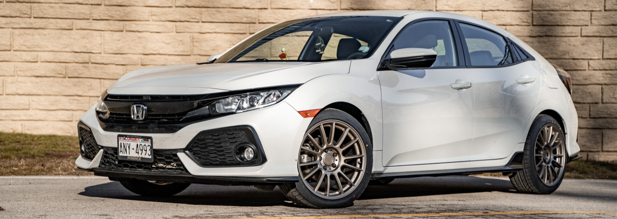 profile view of white car with kosic drs-7 tires