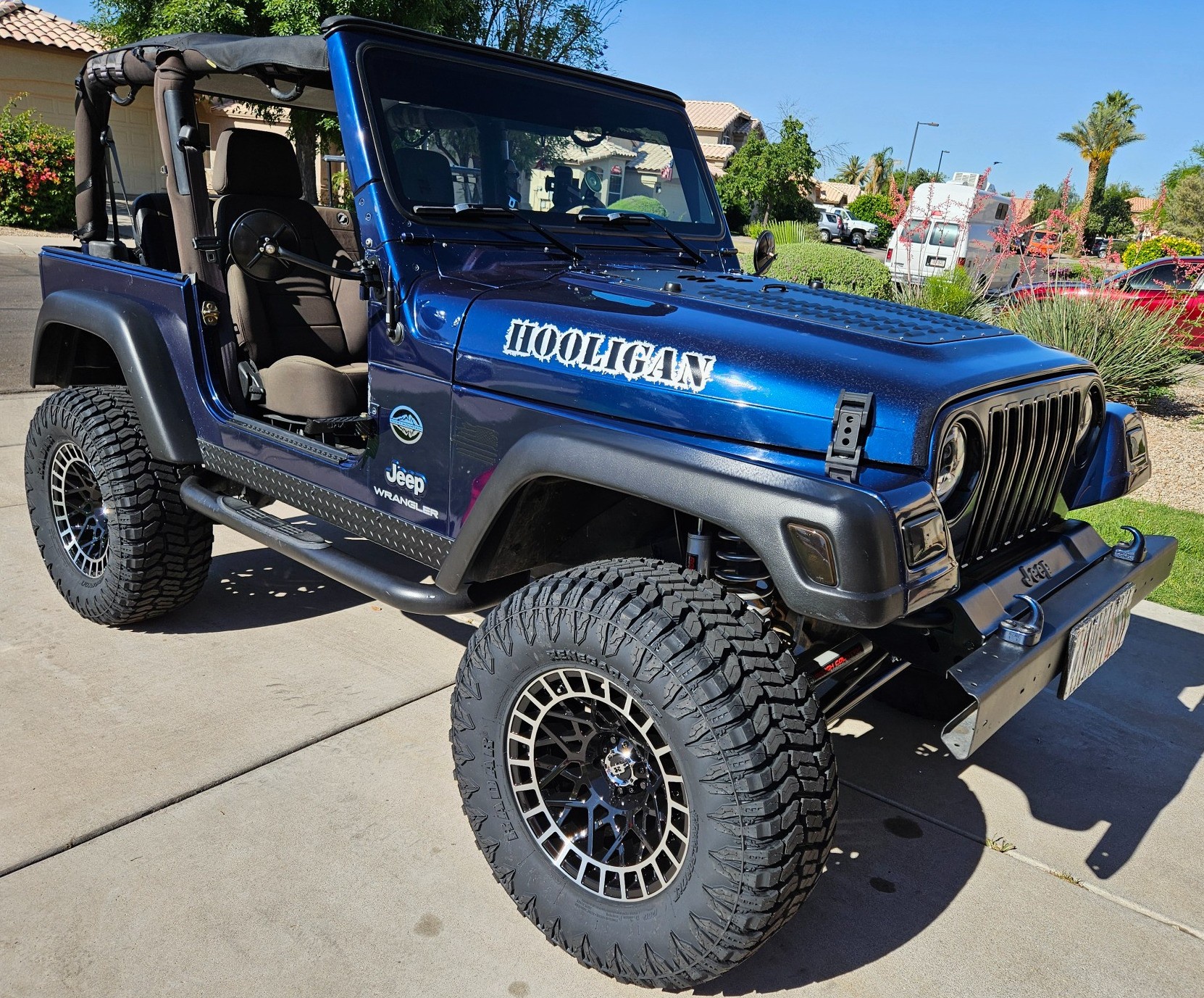 front view of blue jeep wrangler tj