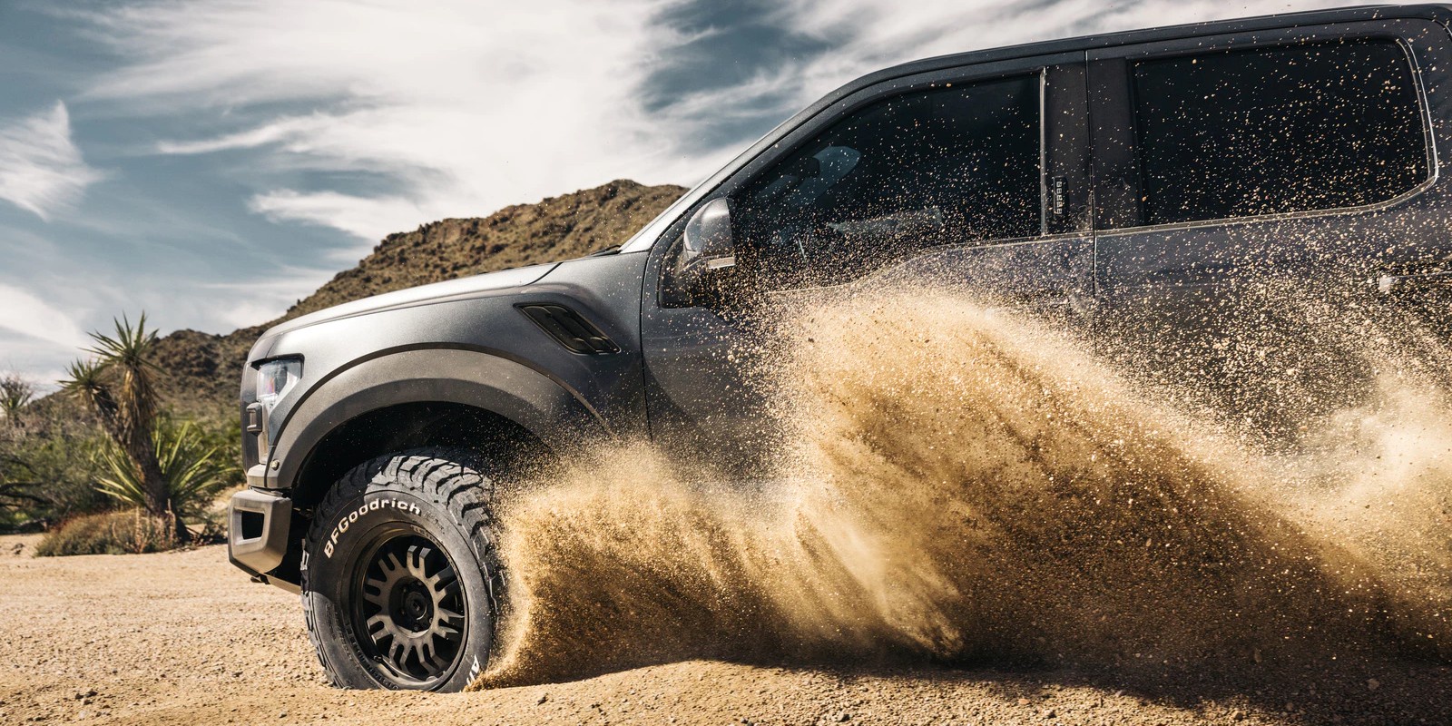 KO3 driving through sand