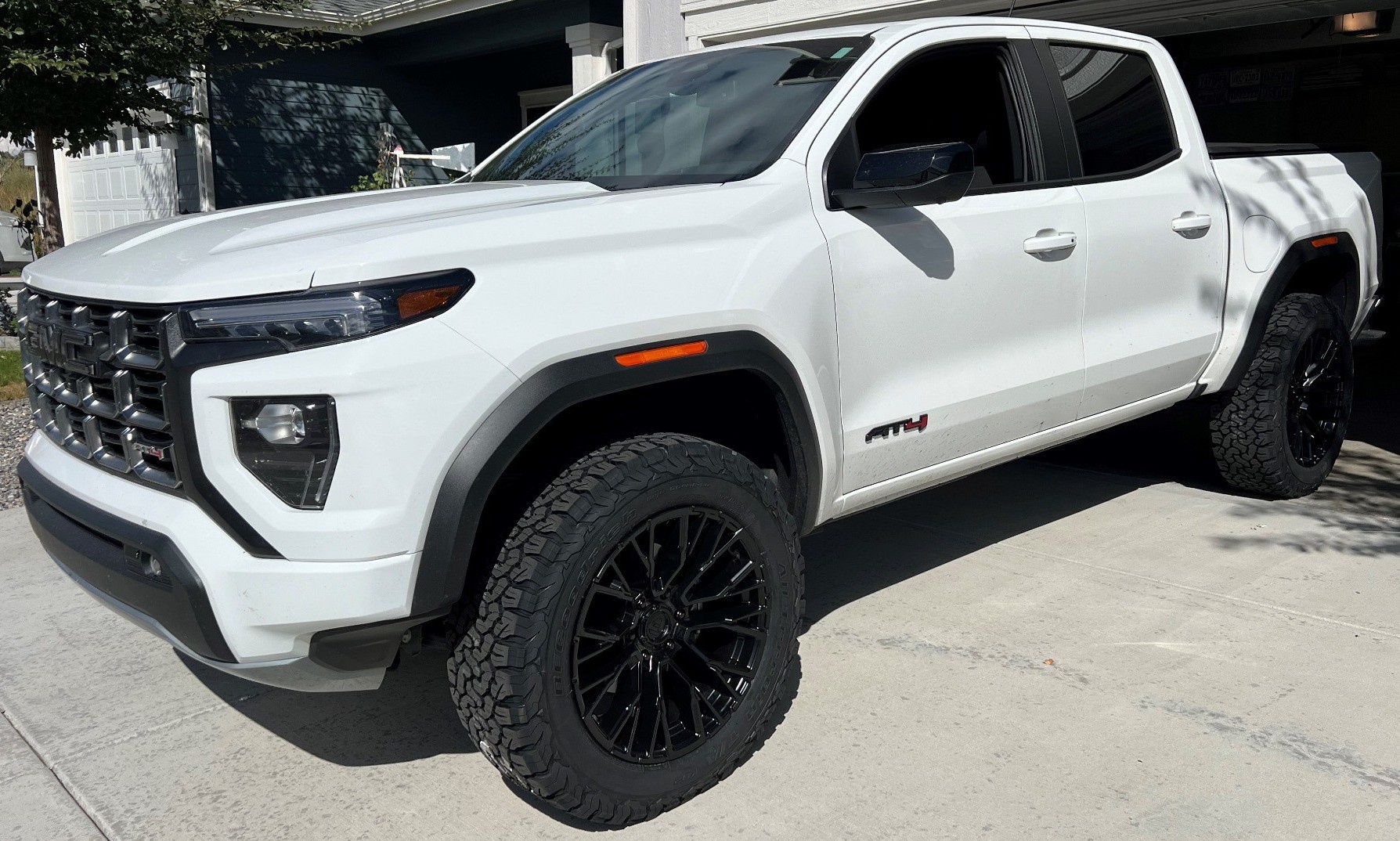 white gmc canyon in driveway