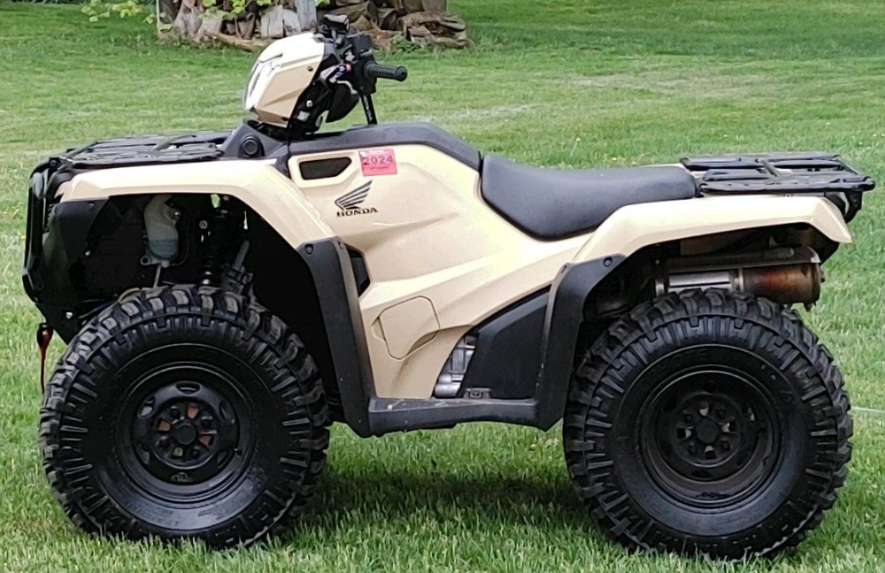 profile view of honda atv with radial tires