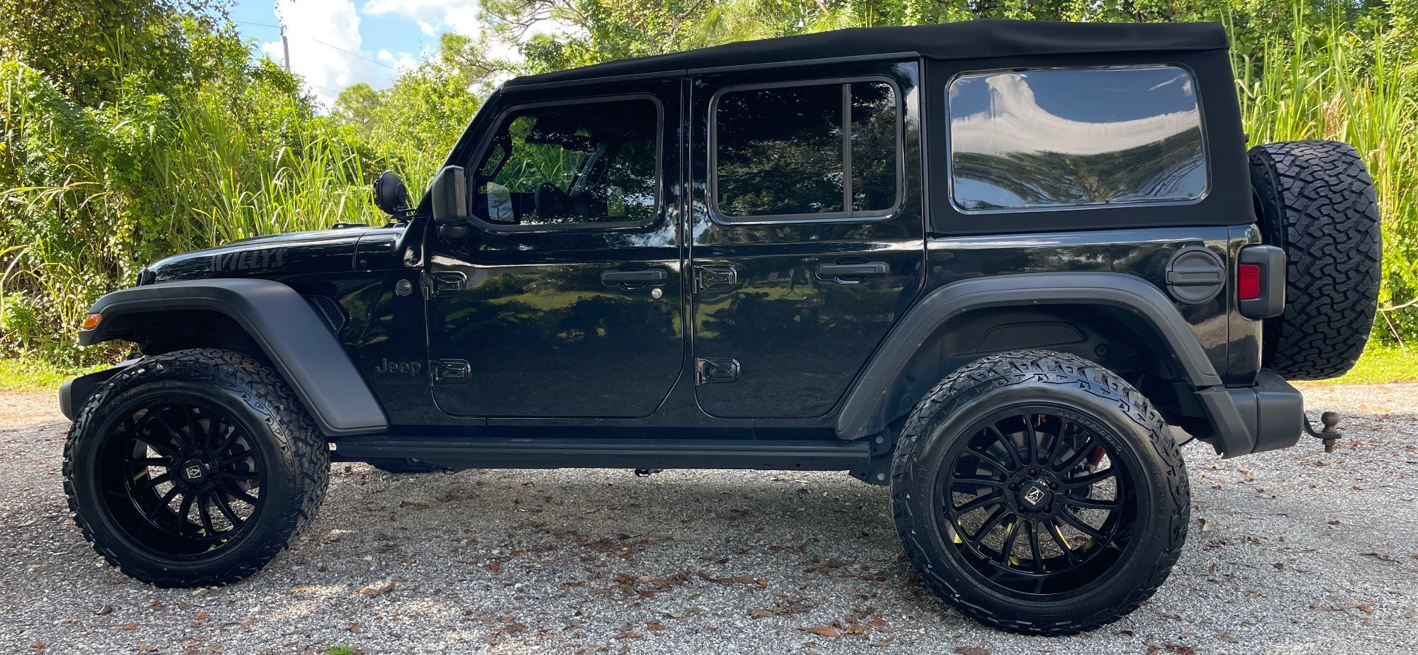 profile view of black off-roader on trail