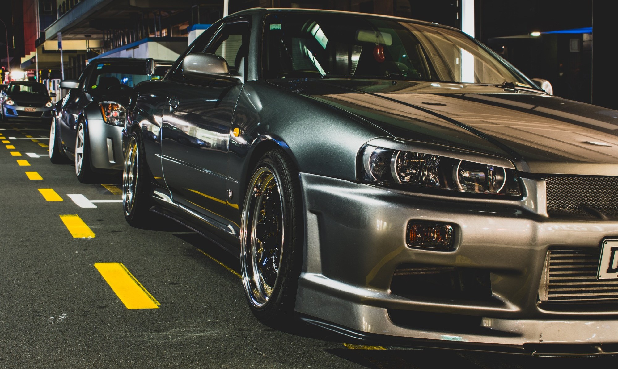 nissan skyline on dark road at night