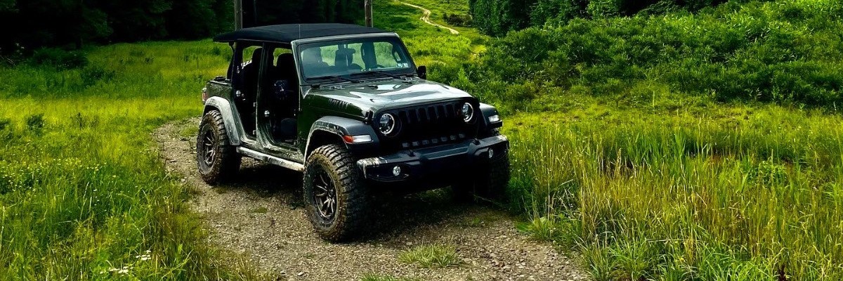 front view of jeep wrangler on trail