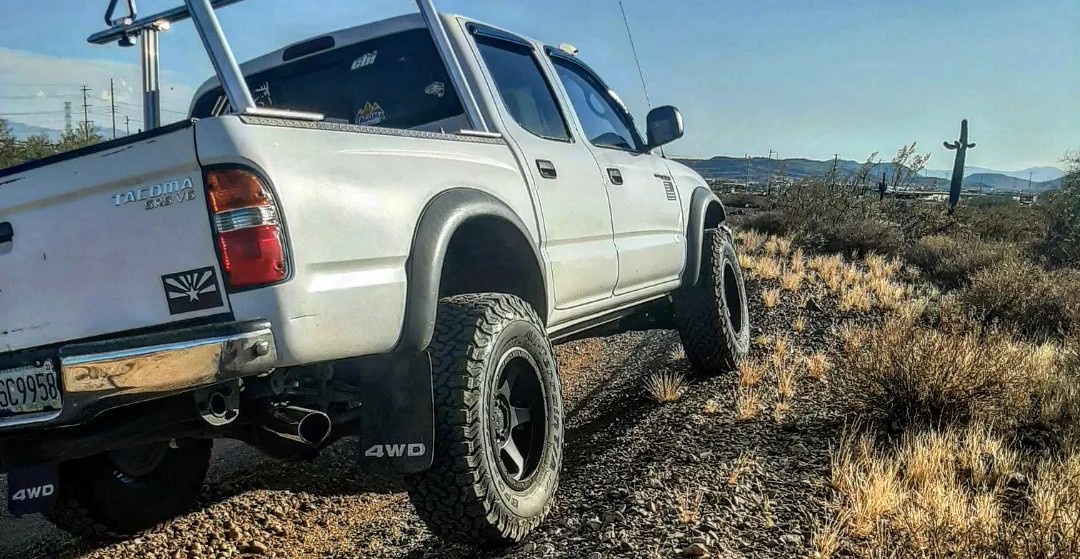 Rear view of Toyota Tacoma on dirt road